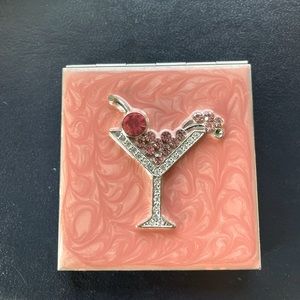 Adorable mirror compact with martini on front.